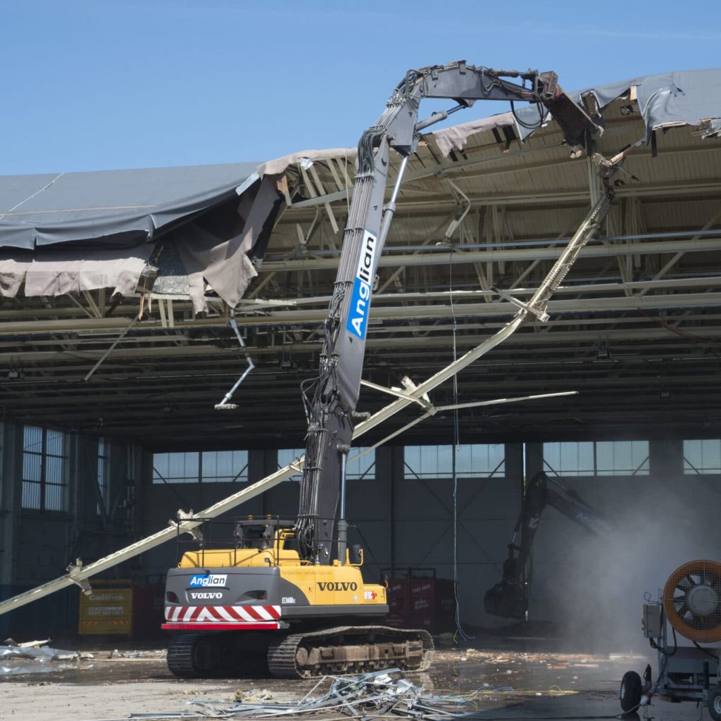 High reach machine demolishing RAF hangar